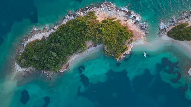 Aerial view of the island and turquoise waters in Ksamil Albania.