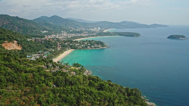 Aerial view of the lush green coastline turquoise water and sandy beaches of Phuket Phuket Thailand. Aerial view of the lush green coastline turquoise water and sandy beaches of Phuket Phuket Thailand.