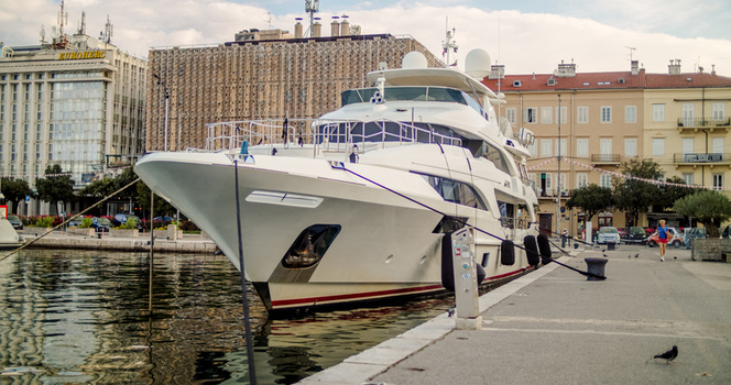 Rijeka Croatia 19 September 2026 View of a large white luxury yacht moored at the harbor quay with historic buildings in the background under a clear sky. Rijeka Croatia 19 September 2026 View of a large white luxury yacht moored at the harbor quay with historic buildings in the background under a clear sky.