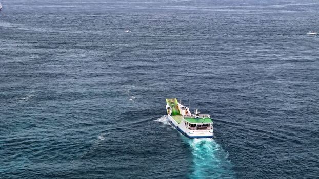 Aerial view of a ferry boat crossing the ocean Indonesia.