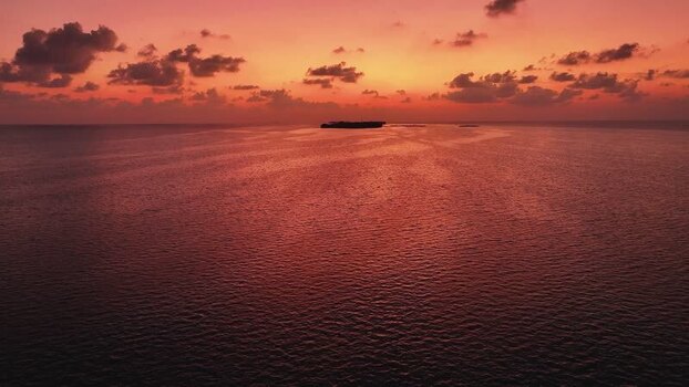 Aerial view of a tropical sunset over the Indian Ocean Maldives. Aerial view of a tropical sunset over the Indian Ocean Maldives.
