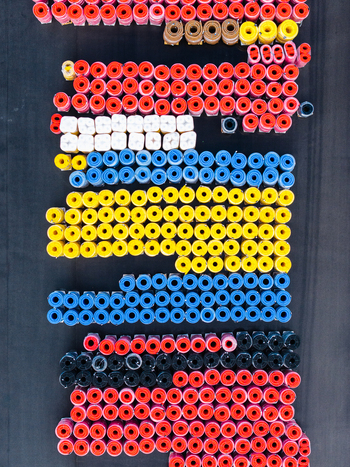 Aerial view of high efficiency pipe systems and industrial polymer coils arranged in organized rows at a manufacturing facility in Jelgava Latvia. Aerial view of high efficiency pipe systems and industrial polymer coils arranged in organized rows at a manufacturing facility in Jelgava Latvia.