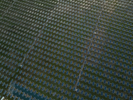 Aerial view of rows of solar panels in a large photovoltaic power plant on green fields Augusta Sicily Italy. Aerial view of rows of solar panels in a large photovoltaic power plant on green fields Augusta Sicily Italy.
