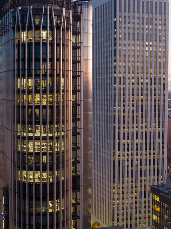 Aerial view of modern office skyscrapers with illuminated windows at dusk in Madrid Community of Madrid Spain. Aerial view of modern office skyscrapers with illuminated windows at dusk in Madrid Community of Madrid Spain.