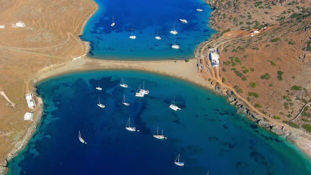 Aerial view of Simos Beach with sailboats in Greece. Aerial view of Simos Beach with sailboats in Greece.