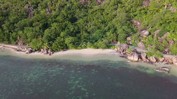 Aerial view of Praslin beach with granite boulders Seychelles.
