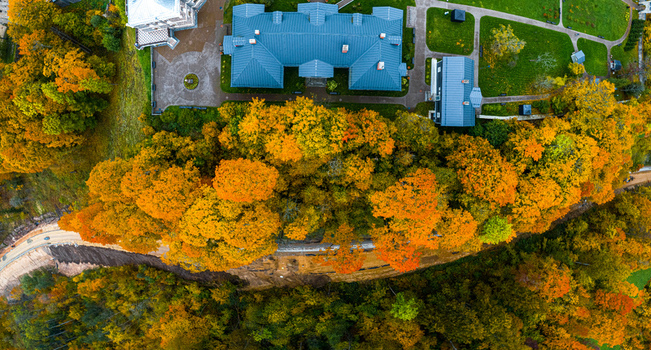 Aerial view of Sigulda New Castle surrounded by vibrant autumn foliage and lush trees in Sigulda Sigulda Municipality Latvia. Aerial view of Sigulda New Castle surrounded by vibrant autumn foliage and lush trees in Sigulda Sigulda Municipality Latvia.