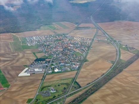 Aerial view of the stark geometry of the star shaped fortress town contrasting with the soft undulating fields Neuf Brisach Grand Est France.