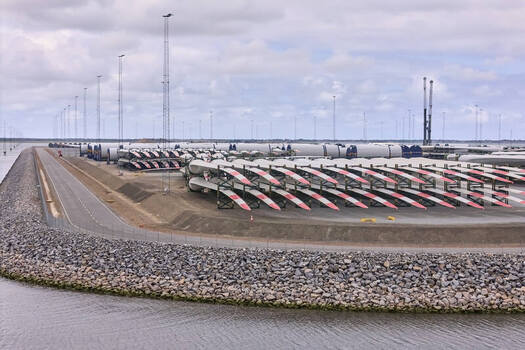 Esbjerg Denmark 24 July 2026 Aerial view of Esbjerg Port featuring rows of Vestas wind turbine blades and mast components stored on the ground ready for transport to offshore wind farms.