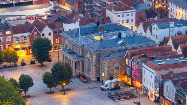 Aerial view of the historic Guildhall and Market Square with traditional brick buildings stone architecture and urban rooftops in Salisbury England United Kingdom. Aerial view of the historic Guildhall and Market Square with traditional brick buildings stone architecture and urban rooftops in Salisbury England United Kingdom.