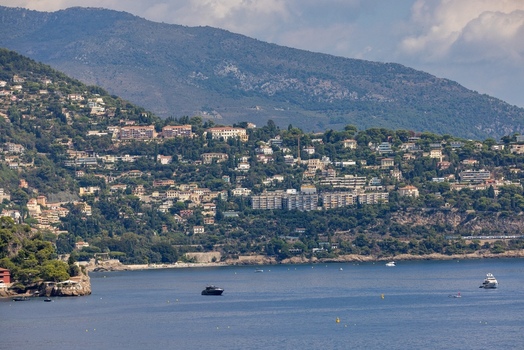 Aerial view of the hillside architecture of Monaco City overlooking the Mediterranean Sea with luxury yachts Monaco Monaco.