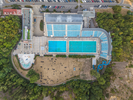Aerial view of Swimming Stadium Podoli with its outdoor swimming pools grandstands and surrounding greenery in Prague Prague Czechia. Aerial view of Swimming Stadium Podoli with its outdoor swimming pools grandstands and surrounding greenery in Prague Prague Czechia.