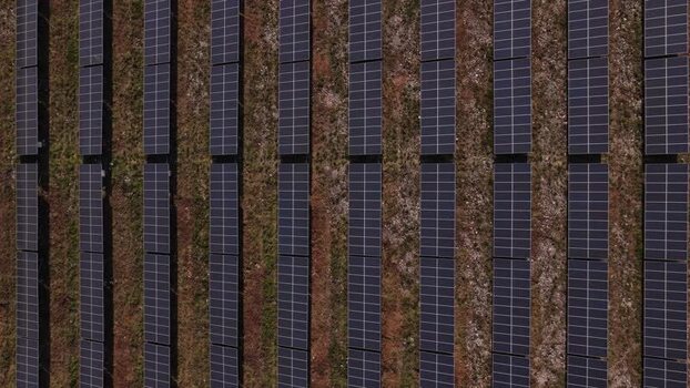 Aerial view of rows of solar panels in a solar farm Portugal. Aerial view of rows of solar panels in a solar farm Portugal.