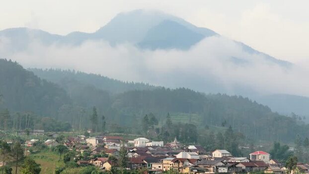 Aerial view of a village and misty mountain landscape Indonesia. Aerial view of a village and misty mountain landscape Indonesia.