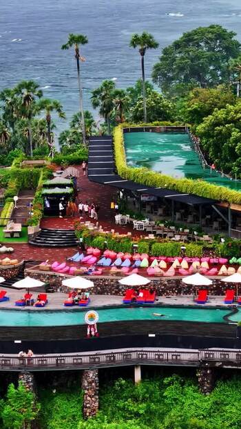 Aerial view of a tropical resort pool area in Bali Indonesia.