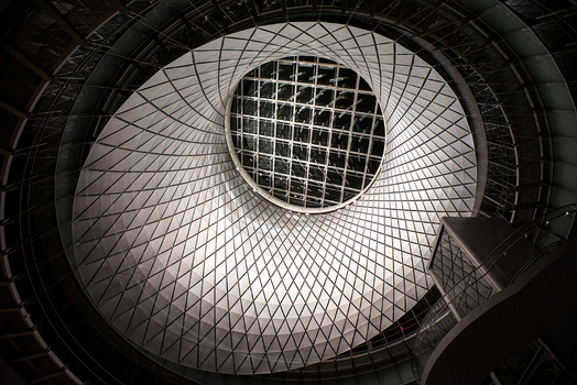 View of the modern latticed oculus at Fulton Center subway station with its intricate metal structure and circular skylight in New York New York United States. View of the modern latticed oculus at Fulton Center subway station with its intricate metal structure and circular skylight in New York New York United States.