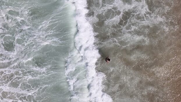 Aerial view of waves crashing on Copacabana Beach Brazil.