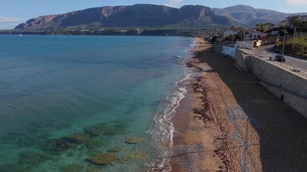 Aerial view of Terrasini coastline and mountains Italy.
