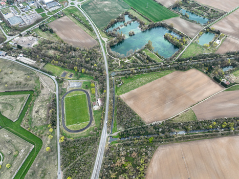 Aerial view of geometric fields contrasting with the organic shapes of the waterways and the precise lines of the Vauban fortifications Neuf Brisach Grand Est France.