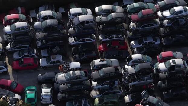 Aerial view of stacked cars in junkyard Portugal.