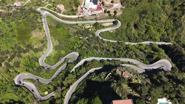 Aerial view of a winding mountain road with hairpin turns Italy. Aerial view of a winding mountain road with hairpin turns Italy.