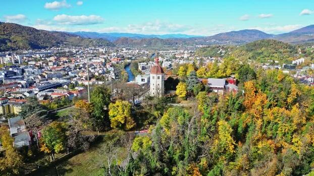 Aerial view of the Graz Clock Tower and autumn trees Austria. Aerial view of the Graz Clock Tower and autumn trees Austria.