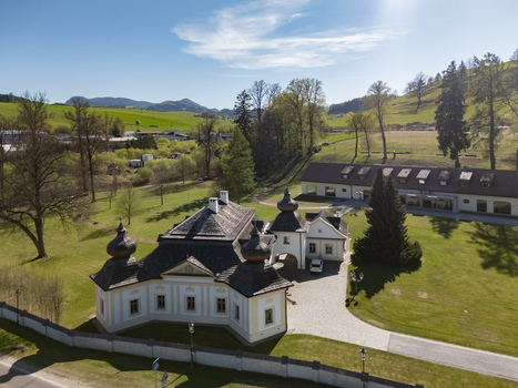 Aerial view of the historic Kastiel Kubinyi manor house featuring onion domed towers and lush green gardens under a clear sky in Vysny Kubin Zilinsky kraj Slovakia. Aerial view of the historic Kastiel Kubinyi manor house featuring onion domed towers and lush green gardens under a clear sky in Vysny Kubin Zilinsky kraj Slovakia.