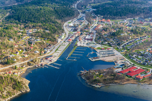 Aerial view of the marina with boats residential houses and surrounding forests in Henan Vastra Gotaland County Sweden. Aerial view of the marina with boats residential houses and surrounding forests in Henan Vastra Gotaland County Sweden.