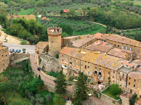 Aerial view of the medieval Torre di Ficulle and historic terracotta rooftops of the village surrounded by lush green hills and olive groves in Ficulle Umbria Italy. Aerial view of the medieval Torre di Ficulle and historic terracotta rooftops of the village surrounded by lush green hills and olive groves in Ficulle Umbria Italy.