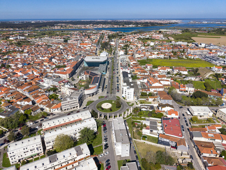 Aerial view of a vibrant Portuguese town where terracotta roofs meet the modern architecture of a bustling roundabout Póvoa de Varzim Portugal. Aerial view of a vibrant Portuguese town where terracotta roofs meet the modern architecture of a bustling roundabout Póvoa de Varzim Portugal.