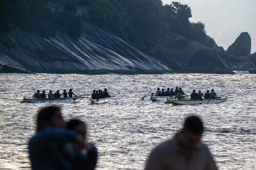 Rio de Janeiro Brazil 06 June 2026 View of rowers in outrigger canoes on the water near the rocky cliffs of Red Beach.