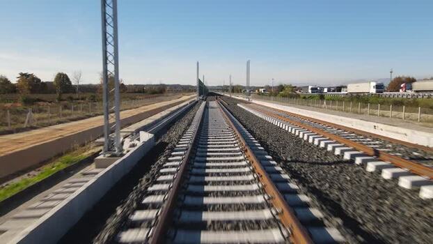 Aerial view of high speed railway tracks and highway Italy.