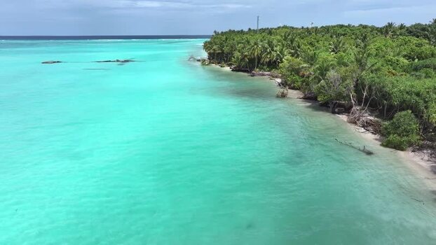Aerial view of a tropical island coastline and turquoise water Maldives. Aerial view of a tropical island coastline and turquoise water Maldives.