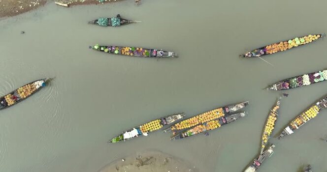 Aerial view of wooden boats with produce on a river Bangladesh.