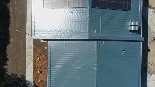 Aerial view of industrial building with solar panels Latvia.