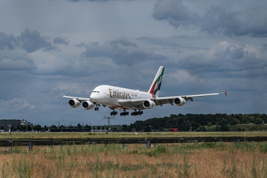 Berlin Germany 09 June 2026 View of an Emirates Airbus A380 landing at the ILA Berlin Air Show with a cloudy sky in the background.