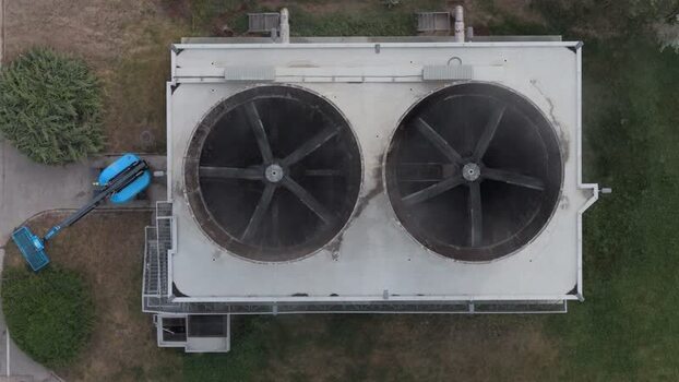 Aerial view of industrial cooling fans on a rooftop Czechia. Aerial view of industrial cooling fans on a rooftop Czechia.