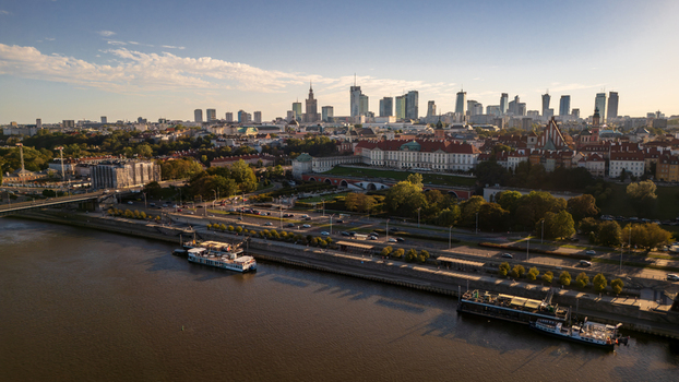 Aerial view of the Vistula River reflecting the skyline and Royal Castle contrasting with the old town s red roofs Warsaw Poland. Aerial view of the Vistula River reflecting the skyline and Royal Castle contrasting with the old town s red roofs Warsaw Poland.