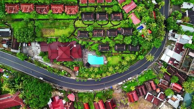 Aerial view of resort villas and swimming pool in Bali Indonesia.