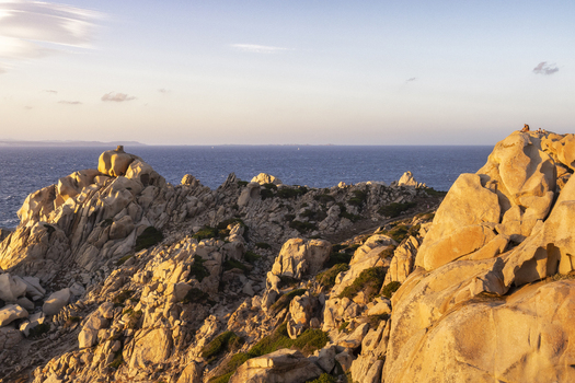 View of the rugged granite rock formations of Capo Testa at sunset with the Mediterranean sea in the background Capo Testa Sardegna Italy.