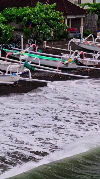 Aerial view of traditional jukung boats on a beach Indonesia.
