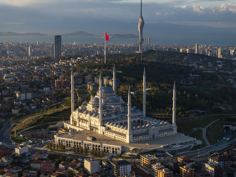 Aerial view of the Grand Camlica Mosque a grand architectural landmark with multiple minarets and a large central dome set against the sprawling urban landscape of Uskudar Istanbul Turkey. Aerial view of the Grand Camlica Mosque a grand architectural landmark with multiple minarets and a large central dome set against the sprawling urban landscape of Uskudar Istanbul Turkey.
