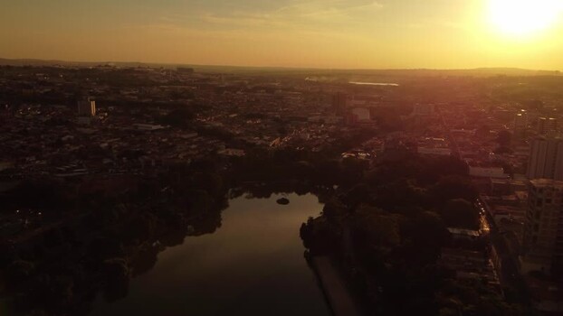 Aerial view of sunset over the lake and city in Araras Brazil. Aerial view of sunset over the lake and city in Araras Brazil.