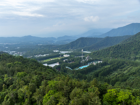 Aerial view of Formosan Aboriginal Culture Village nestled within the lush green mountains of Yuchi Township Nantou County Taiwan. Aerial view of Formosan Aboriginal Culture Village nestled within the lush green mountains of Yuchi Township Nantou County Taiwan.