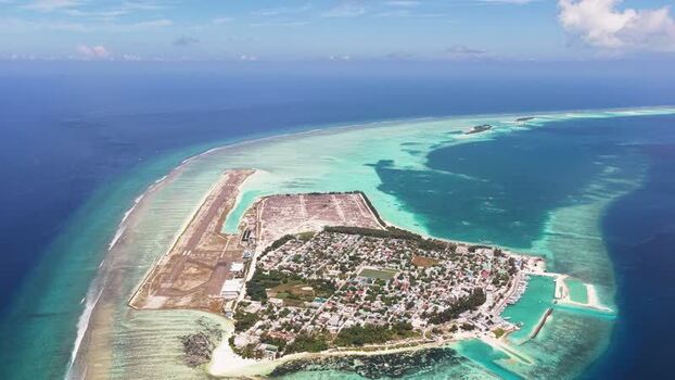 Aerial view of Kudahuvadhoo island and airport Maldives.