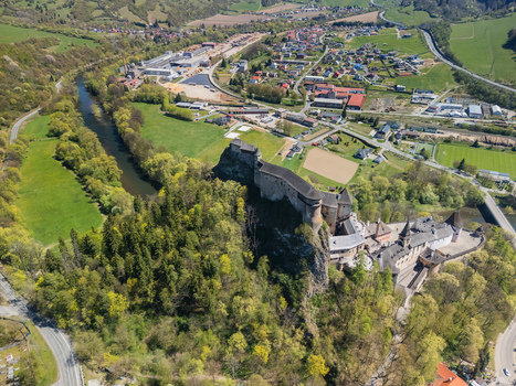 Aerial view of Orava Castle perched on a steep rock above the Orava river surrounded by lush green forests and hills in Dolny Kubin Zilinsky kraj Slovakia. Aerial view of Orava Castle perched on a steep rock above the Orava river surrounded by lush green forests and hills in Dolny Kubin Zilinsky kraj Slovakia.