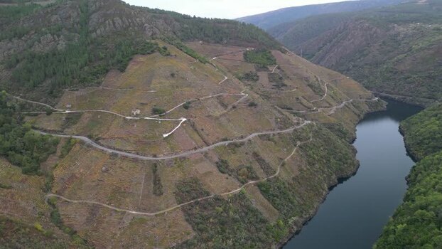 Aerial view of winding river through hills Spain. Aerial view of winding river through hills Spain.