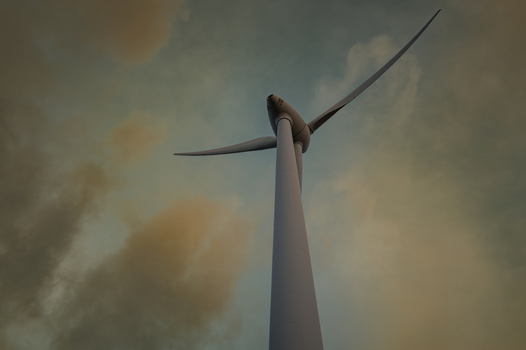View of the Sandpatch wind turbine reaching towards a cloudy sky at sunset in Sandpatch Western Australia Australia. View of the Sandpatch wind turbine reaching towards a cloudy sky at sunset in Sandpatch Western Australia Australia.
