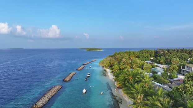Aerial view of tropical island coastline and turquoise waters Maldives. Aerial view of tropical island coastline and turquoise waters Maldives.