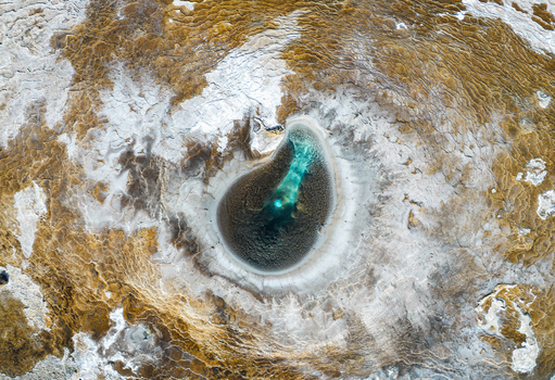 Aerial view of the Hveravellir geothermal hot spring with turquoise water and white mineral deposits in Hunabyggd Iceland. Aerial view of the Hveravellir geothermal hot spring with turquoise water and white mineral deposits in Hunabyggd Iceland.